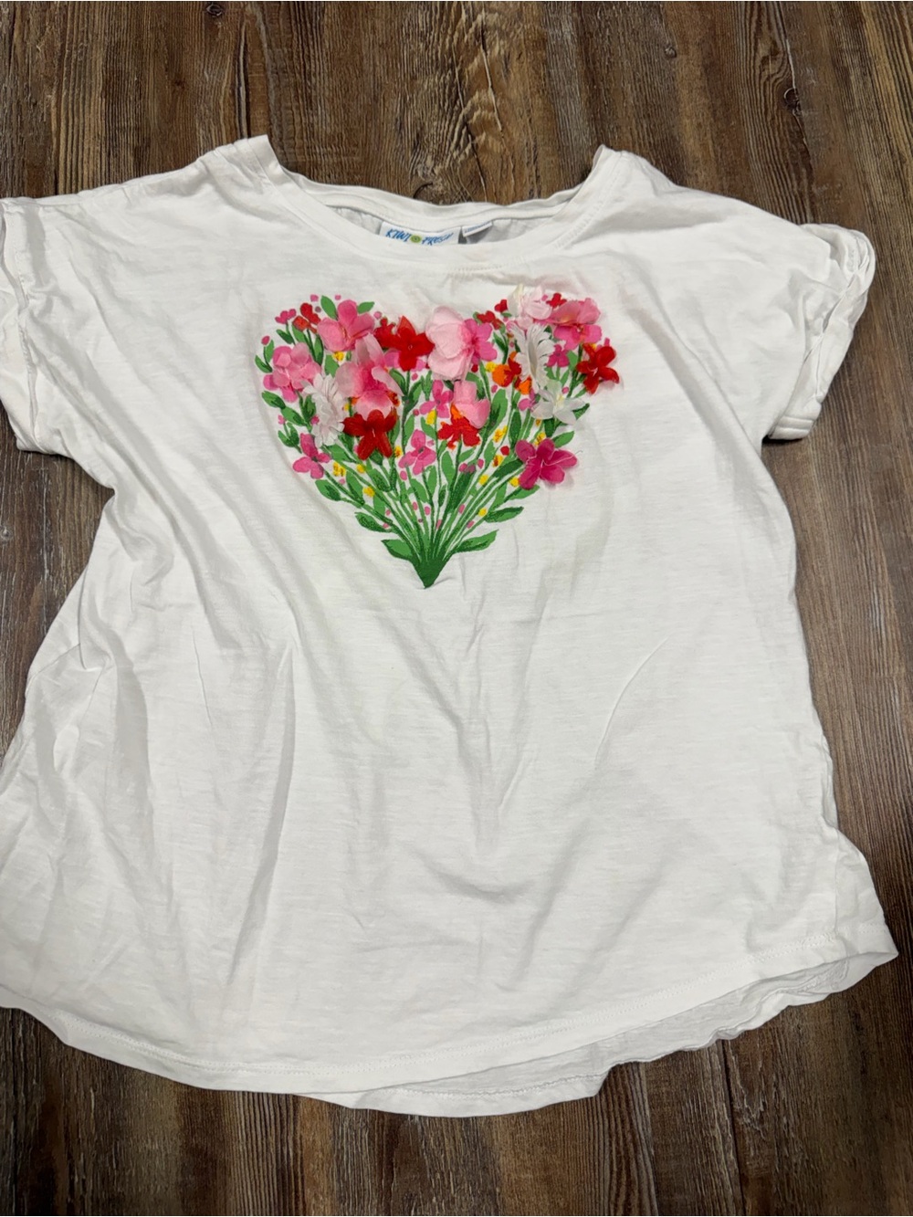 Vintage White floral heart graphic tee with pink, red, and white flowers in a he